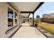 Long covered patio offers ample shade with concrete floors and block wall in the background at 3551 E Shannon St, Gilbert, AZ 85295