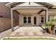 Covered patio area featuring a paved floor, support beams and desert landscaping at 3551 E Shannon St, Gilbert, AZ 85295