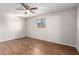 Neutral bedroom with modern ceiling fan and wood-look floors at 3614 W Georgia Ave, Phoenix, AZ 85019