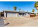 Single story home with gray painted brick, attached garage and low-maintenance landscaping at 3614 W Georgia Ave, Phoenix, AZ 85019