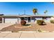 Charming single-story home with gray painted brick and well-maintained landscaping in a sunny locale at 3614 W Georgia Ave, Phoenix, AZ 85019