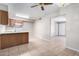 Bright kitchen and open dining area with tile flooring and ceiling fan at 3614 W Georgia Ave, Phoenix, AZ 85019