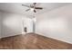 Spacious main bedroom features ceiling fan and wood-look floors at 3614 W Georgia Ave, Phoenix, AZ 85019