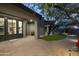 Elegant backyard patio featuring pavers, an outdoor living space, and mature desert landscaping at 37975 N 98Th Pl, Scottsdale, AZ 85262