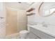 Bathroom featuring a glass shower, vanity with a sink, and a toilet at 3927 W Phelps Rd, Phoenix, AZ 85053