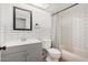 Modern bathroom featuring white subway tile, framed mirror, and shower-tub combination with curtain at 3927 W Phelps Rd, Phoenix, AZ 85053