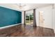 Bedroom with hardwood floors, ceiling fan, a sliding glass door and ensuite bathroom at 3927 W Phelps Rd, Phoenix, AZ 85053