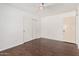 Bedroom featuring hardwood floors and a closet with sliding doors at 3927 W Phelps Rd, Phoenix, AZ 85053