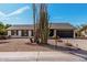 Well-maintained one-story home with desert landscaping, a two-car garage, and modern curb appeal at 3927 W Phelps Rd, Phoenix, AZ 85053