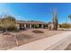 A single Gathering home with desert landscaping, green plants and a two car garage at 3927 W Phelps Rd, Phoenix, AZ 85053