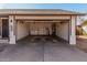 Spacious garage with laundry machines, water heater, storage shelves, and an open door at 3927 W Phelps Rd, Phoenix, AZ 85053