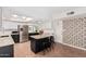 Bright kitchen featuring stainless steel appliances, a center island with bar stools, and skylight at 3927 W Phelps Rd, Phoenix, AZ 85053