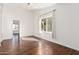 Spacious living room with wood floors, large window and lots of natural light at 3927 W Phelps Rd, Phoenix, AZ 85053