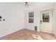 Room with tile floor, a window, a door to the exterior, and a ceiling fan at 3927 W Phelps Rd, Phoenix, AZ 85053