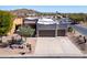 Aerial view of a Southwestern-style home with a two car garage and desert landscaping at 4309 S Priceless View Dr, Gold Canyon, AZ 85118