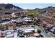 Scenic aerial view of luxury homes near a golf course in a beautiful desert landscape at 4309 S Priceless View Dr, Gold Canyon, AZ 85118