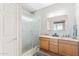 Bathroom featuring a double vanity, wood cabinetry, and a glass-enclosed walk-in shower at 4309 S Priceless View Dr, Gold Canyon, AZ 85118