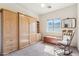 Bedroom with a built-in murphy bed, natural light, and carpeted floors at 4309 S Priceless View Dr, Gold Canyon, AZ 85118