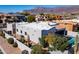 Modern home exterior featuring a white roof, desert landscaping, and a private pool area at 4309 S Priceless View Dr, Gold Canyon, AZ 85118