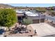 Stylish home featuring a multi-car garage, desert landscaping, and mountain views at 4309 S Priceless View Dr, Gold Canyon, AZ 85118