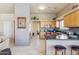 Spacious kitchen with wood cabinetry, dark countertops, tiled backsplash, and open layout at 4309 S Priceless View Dr, Gold Canyon, AZ 85118