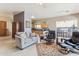 Inviting living room with neutral tones, sofa, recliners, and an open floor plan to the kitchen at 4309 S Priceless View Dr, Gold Canyon, AZ 85118