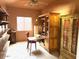 Home office featuring bright natural light, built-in shelving and desk, and decorative wooden cabinets at 4309 S Priceless View Dr, Gold Canyon, AZ 85118
