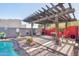 Outdoor pergola with a stainless steel grill and desert landscaping at 4309 S Priceless View Dr, Gold Canyon, AZ 85118