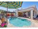 Private backyard with a pool, patio, pergola, and desert landscaping at 4309 S Priceless View Dr, Gold Canyon, AZ 85118