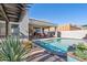 Beautiful pool area with lounge chairs, covered patio, and desert plants at 4309 S Priceless View Dr, Gold Canyon, AZ 85118