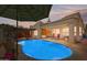 Beautiful backyard pool area with a covered patio and desert landscape at 4309 S Priceless View Dr, Gold Canyon, AZ 85118