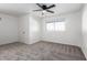 Bedroom featuring a ceiling fan, window with blinds, and neutral carpet at 4341 W Ocotillo Rd, Glendale, AZ 85301