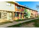 A row of townhomes with a sidewalk leading to the front doors, with multiple color schemes at 4341 W Ocotillo Rd, Glendale, AZ 85301