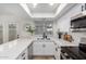 Bright kitchen features white cabinets, stainless steel appliances, and quartz countertops at 4341 W Ocotillo Rd, Glendale, AZ 85301