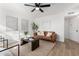 Bright living room with modern decor, a comfortable brown sofa, and stylish accents at 4341 W Ocotillo Rd, Glendale, AZ 85301