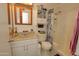 Bathroom featuring shower/tub, toilet, sink, vanity, and mirror at 4428 W Mission Ln, Glendale, AZ 85302