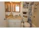 Bathroom featuring shower/tub, toilet, vanity with sink and mirror at 4428 W Mission Ln, Glendale, AZ 85302