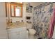 Bathroom with shower/tub, sink, vanity, mirror, and toilet at 4428 W Mission Ln, Glendale, AZ 85302