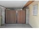 Sturdy wooden privacy gate providing security for the carport area at 4428 W Mission Ln, Glendale, AZ 85302