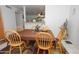 Cozy dining area features a wood table and chairs on top of colorful rug at 4428 W Mission Ln, Glendale, AZ 85302