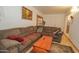 Spacious living room featuring a sectional sofa and coffee table with tile flooring at 4428 W Mission Ln, Glendale, AZ 85302