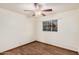 Bright and airy bedroom with wood floors, a window view, and a ceiling fan at 4502 N 2Nd Dr, Phoenix, AZ 85013