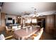 A view of the community room, with tables and chairs, and a view of the kitchen at 455 S Delaware Dr # 106, Apache Junction, AZ 85120