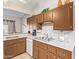 Bright kitchen featuring ample cabinet space, updated countertops, and stainless steel sink at 455 S Delaware Dr # 106, Apache Junction, AZ 85120