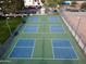 A high angle aerial shot of the blue and green pickleball courts at 455 S Delaware Dr # 106, Apache Junction, AZ 85120