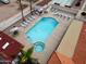 Aerial view of the inviting community pool, hot tub, and lounging area at 455 S Delaware Dr # 106, Apache Junction, AZ 85120