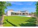 Expansive backyard featuring a well-maintained lawn, a sparkling pool, and a modern home design at 4704 N 40Th Pl, Phoenix, AZ 85018