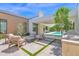 Beautiful backyard featuring a modern fire pit and inviting lounge area, perfect for outdoor gatherings at 4704 N 40Th Pl, Phoenix, AZ 85018
