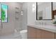 Modern bathroom featuring walk-in shower, sleek vanity, and bright natural light at 4704 N 40Th Pl, Phoenix, AZ 85018
