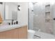 Modern bathroom with walk-in shower, marble-look tile, and sleek fixtures at 4704 N 40Th Pl, Phoenix, AZ 85018